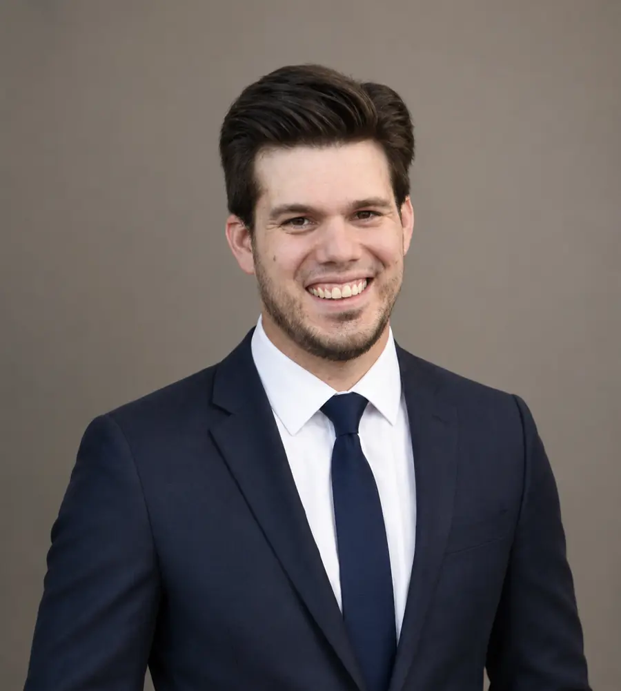 James Barber, P.E., in a navy suit and tie.